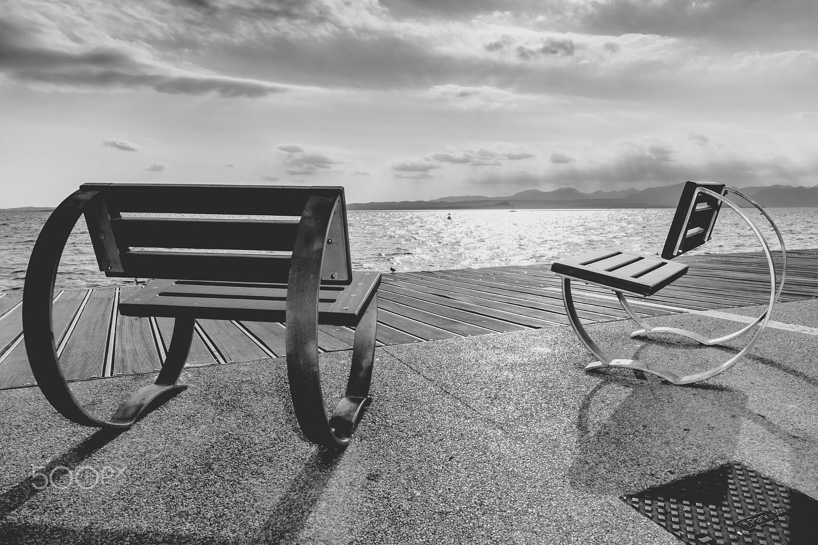 Sony Alpha DSLR-A900 sample photo. Chairs overlooking the lake garda photography