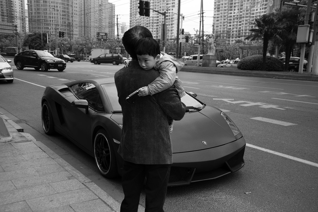 Nikon D810 sample photo. A young boy holds a toy lamborghini has his father ... photography
