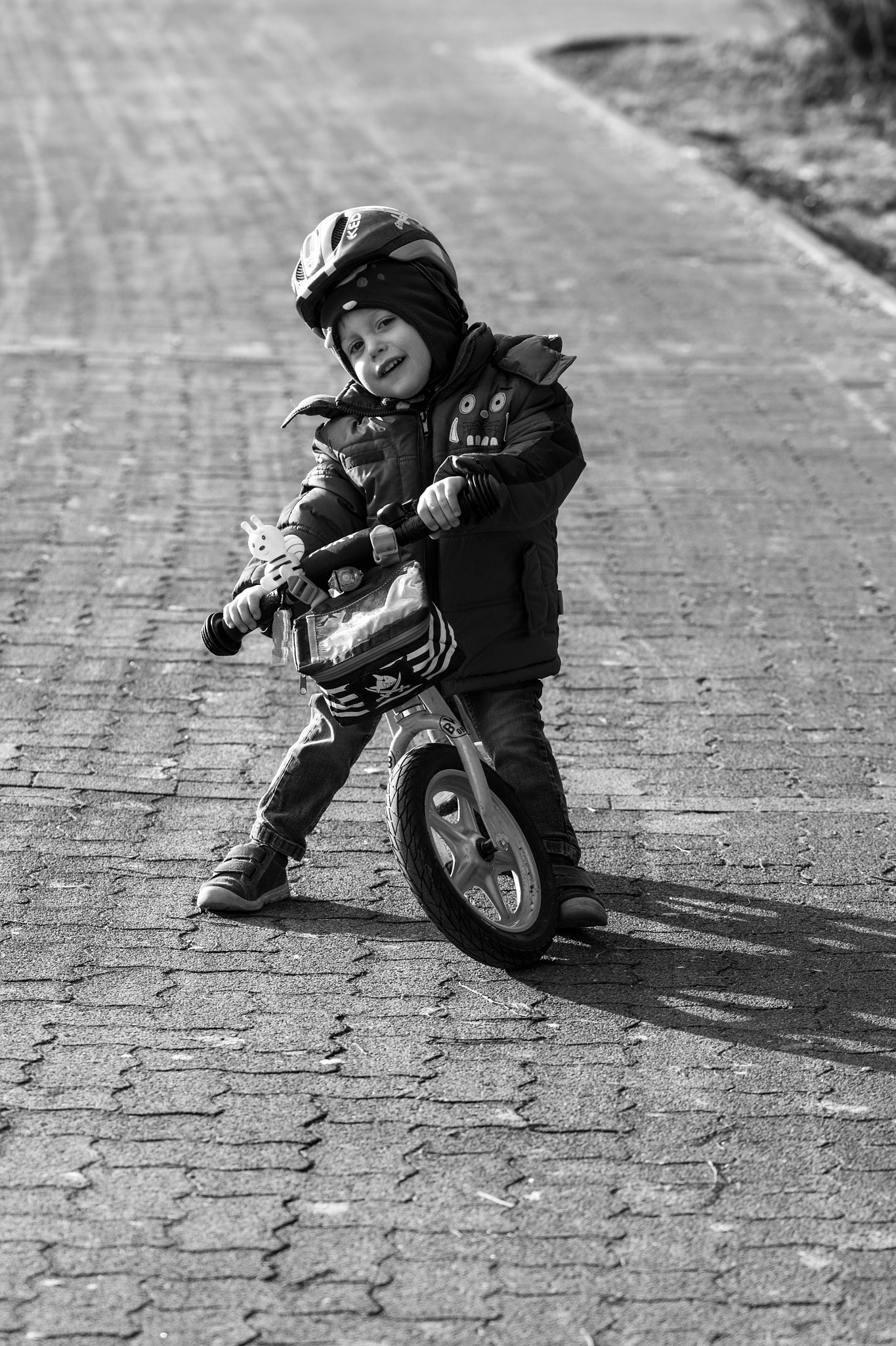 Sigma 105mm F2.8 EX DG OS HSM sample photo. Smal man on bike photography