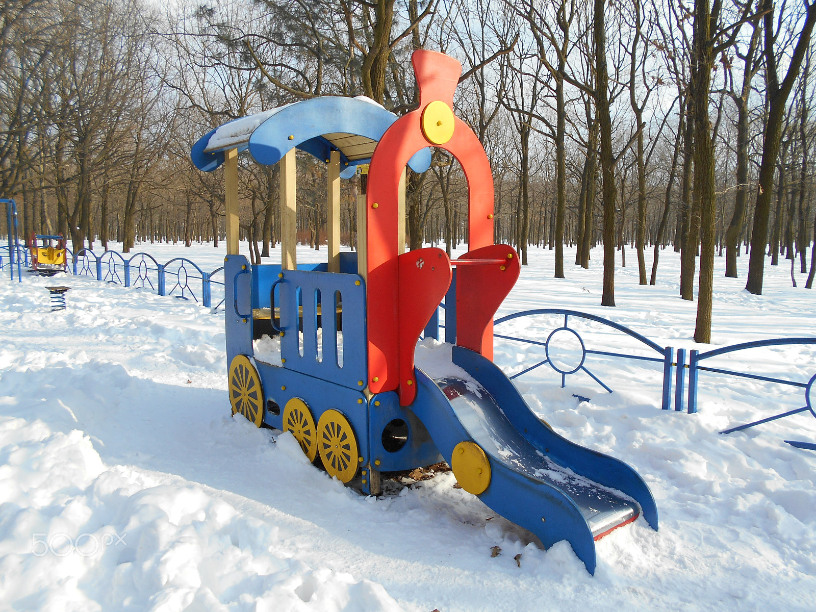 Nikon Coolpix S2900 sample photo. Bright multi-colored children's slide as a locomotive photography
