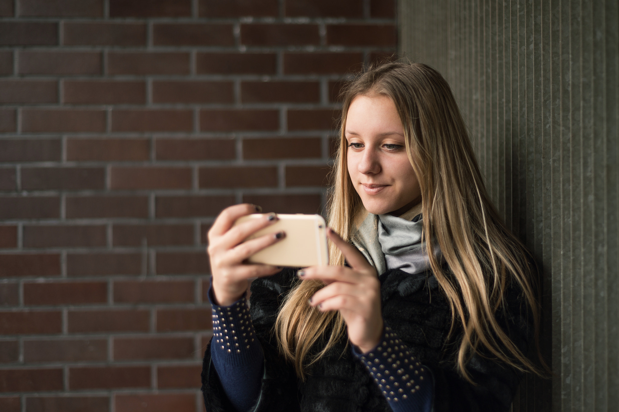 Teenage girl looking at smart phone