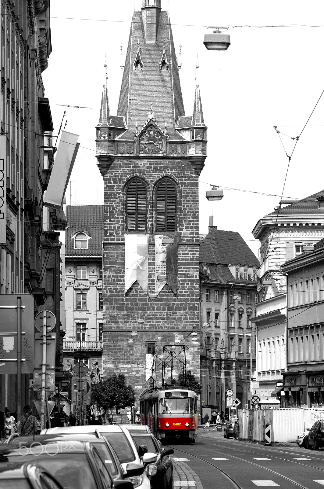 Sony Alpha DSLR-A580 + Sigma 30mm F1.4 EX DC HSM sample photo. Red tram on monochrome prague street photography