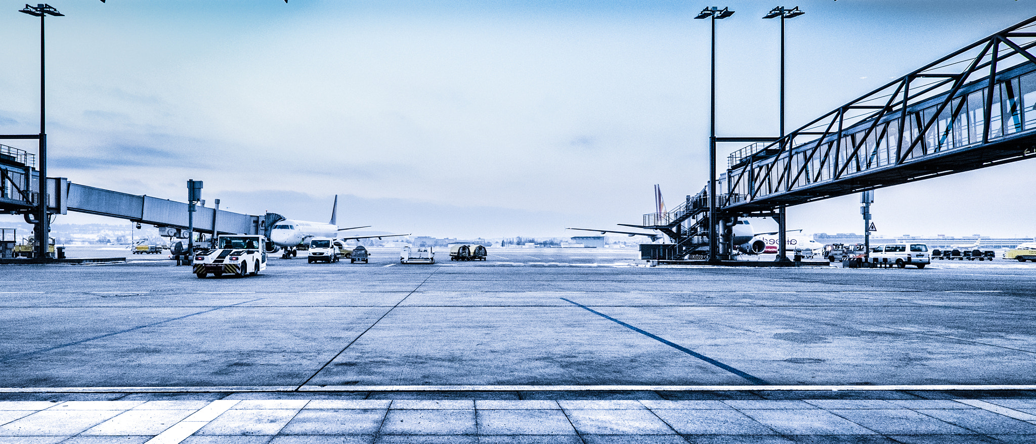 Fujifilm X-T1 + ZEISS Touit 12mm F2.8 sample photo. Cold tarmac - stuttgart airport photography