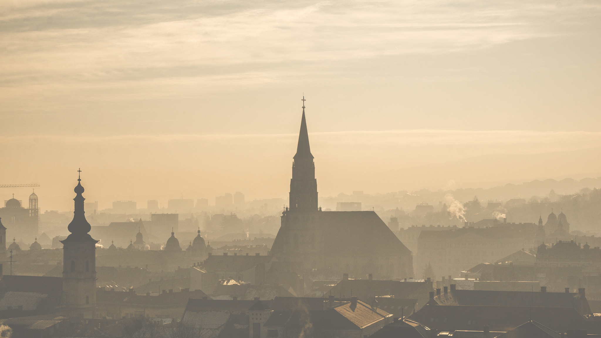 Sony Alpha NEX-5T + Sony E 55-210mm F4.5-6.3 OSS sample photo. Misty rooftops photography