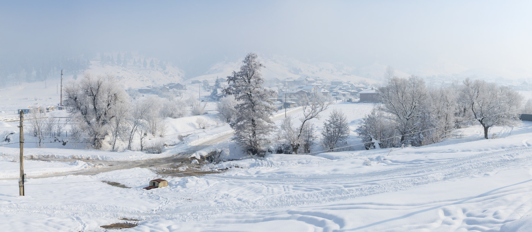 Canon EOS 760D (EOS Rebel T6s / EOS 8000D) + Canon EF 24-105mm F4L IS USM sample photo. Amazing winter landscape. trees and houses covered with hoarfros photography