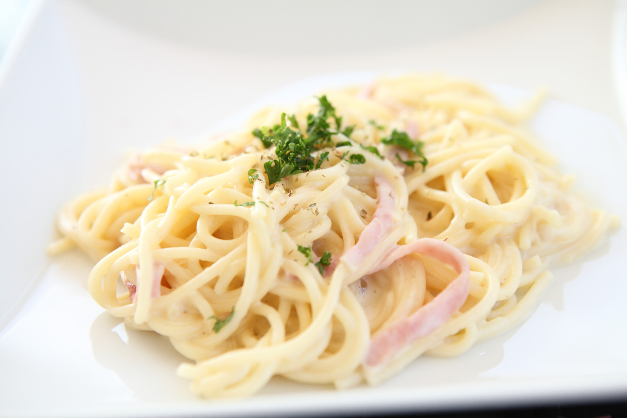 spaghetti white sauce with ham by Piyato Pana / 500px