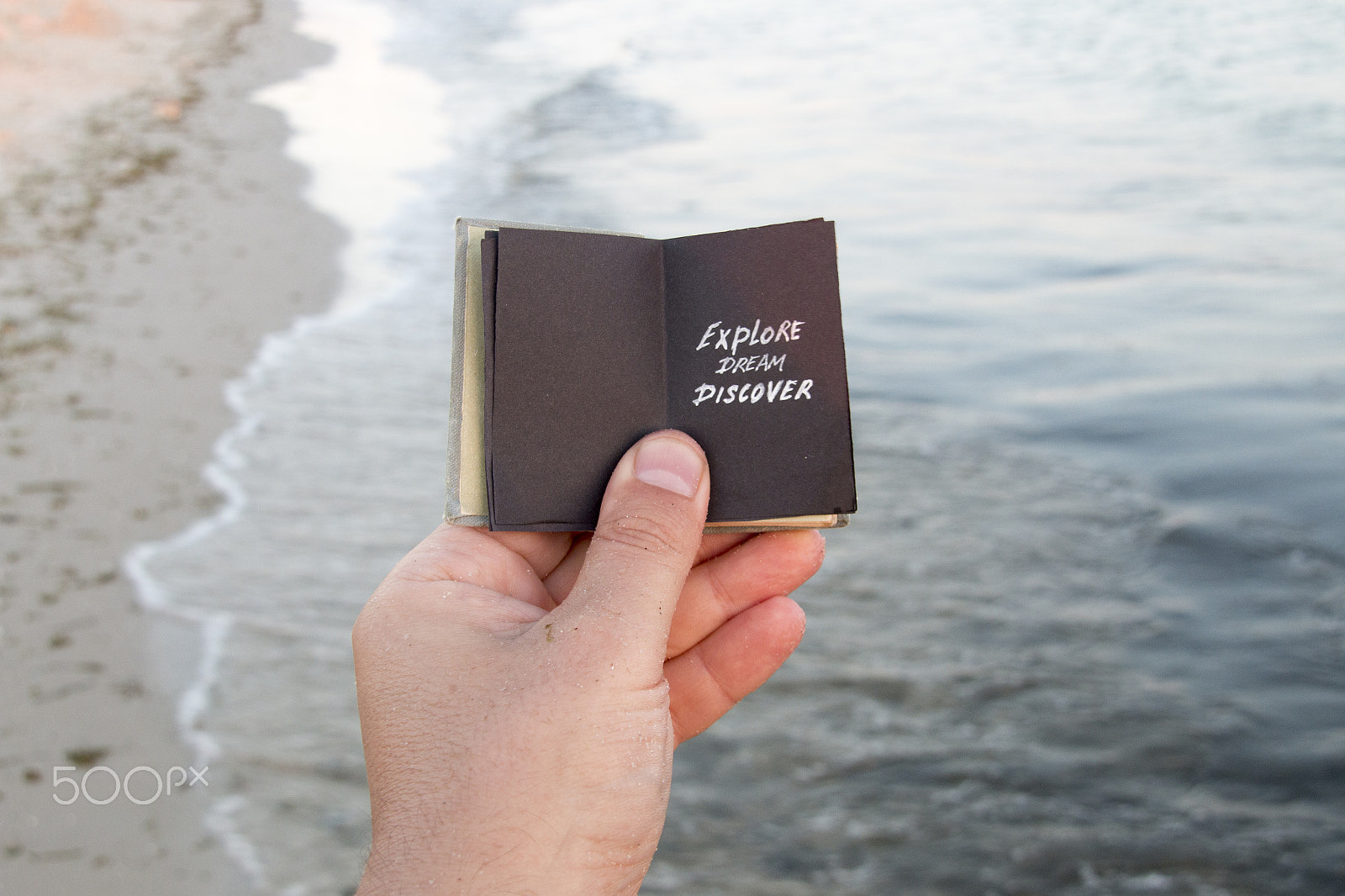 Sigma 18-200mm f/3.5-6.3 DC OS sample photo. Visit beaches idea. hand holding a book with the inscription. photography