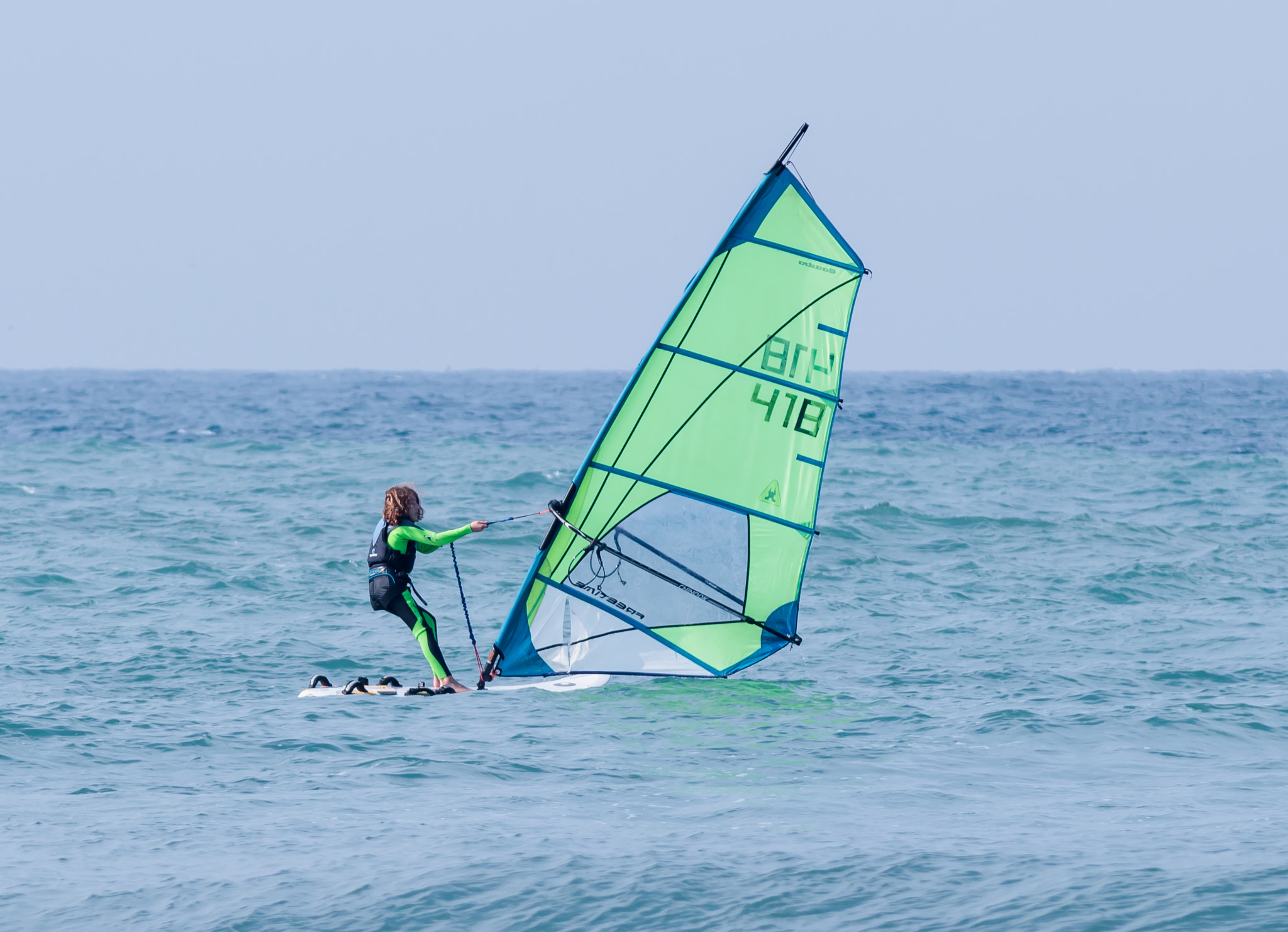 Canon EOS 80D + Sigma 50-200mm F4-5.6 DC OS HSM sample photo. Girl exercising in windsurfing in the mediterranean sea photography
