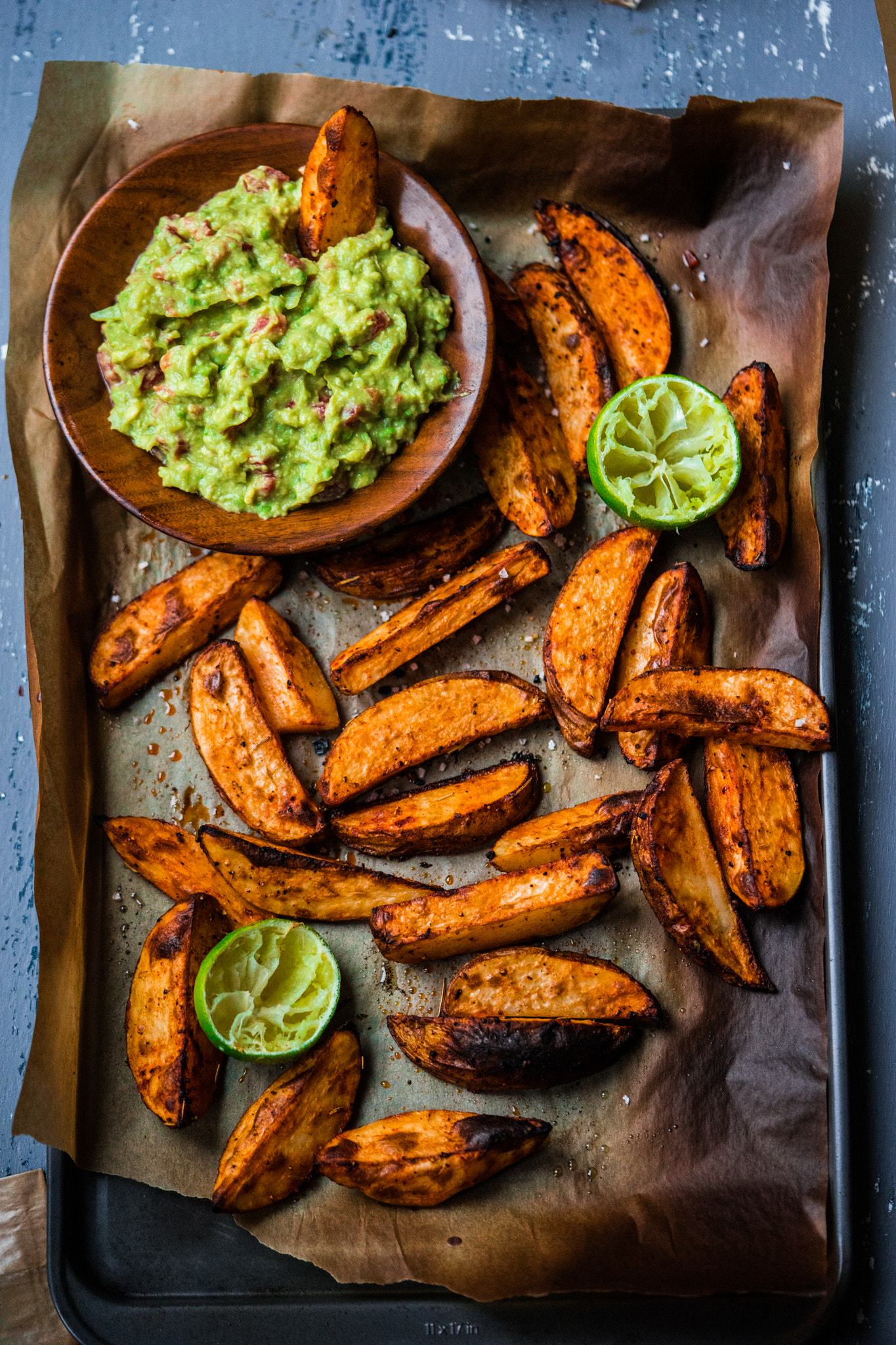 Sony a7 + Sony FE 90mm F2.8 Macro G OSS sample photo. Baked potato wedges with homemade guacamole photography