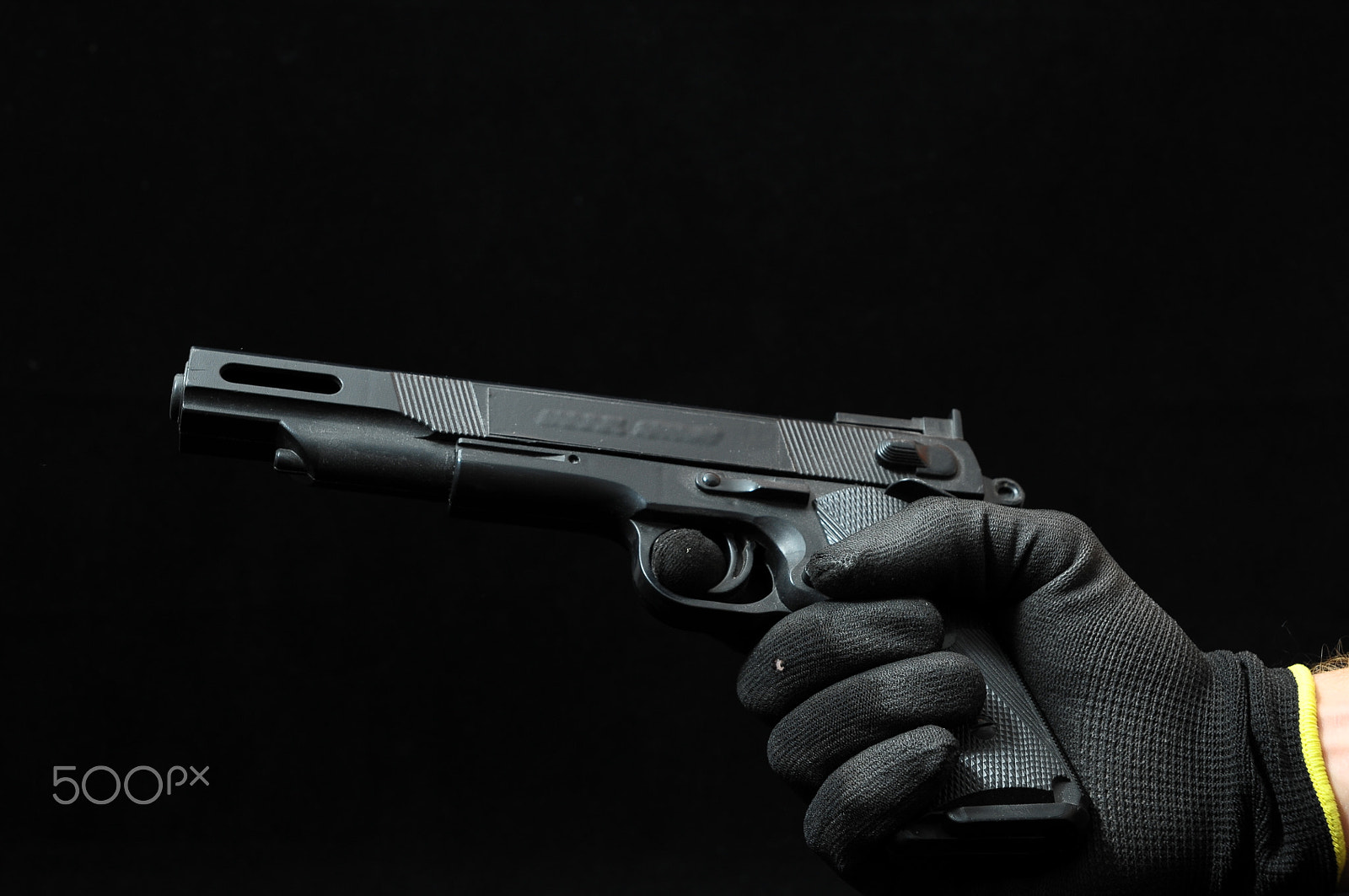 Nikon D300 sample photo. Gun and a hand photography