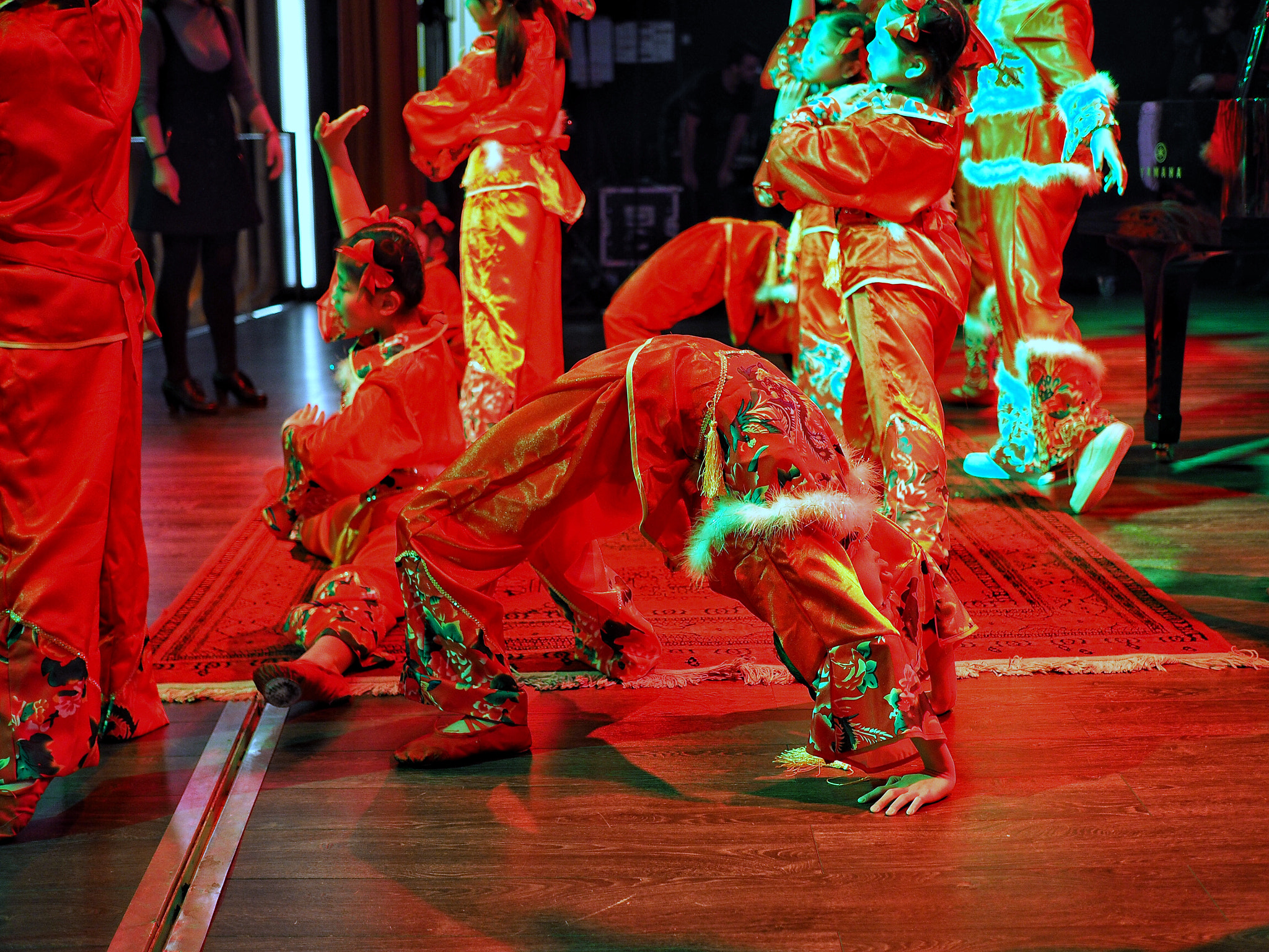 Olympus OM-D E-M1 sample photo. Chinese children dancing in madrid to celebrate the spring festival photography