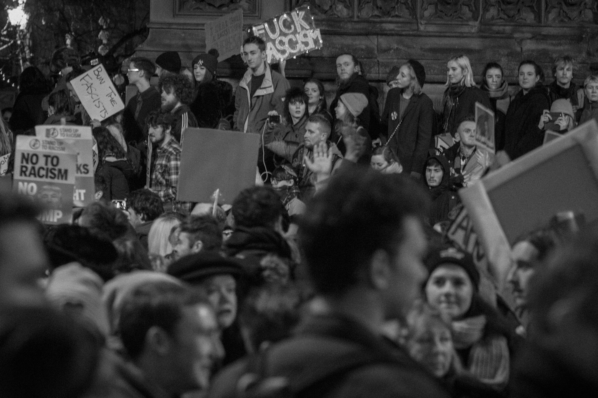 Canon EOS 650D (EOS Rebel T4i / EOS Kiss X6i) + Canon EF 85mm F1.8 USM sample photo. Pro-refugee, anti- trump manchester demo photography