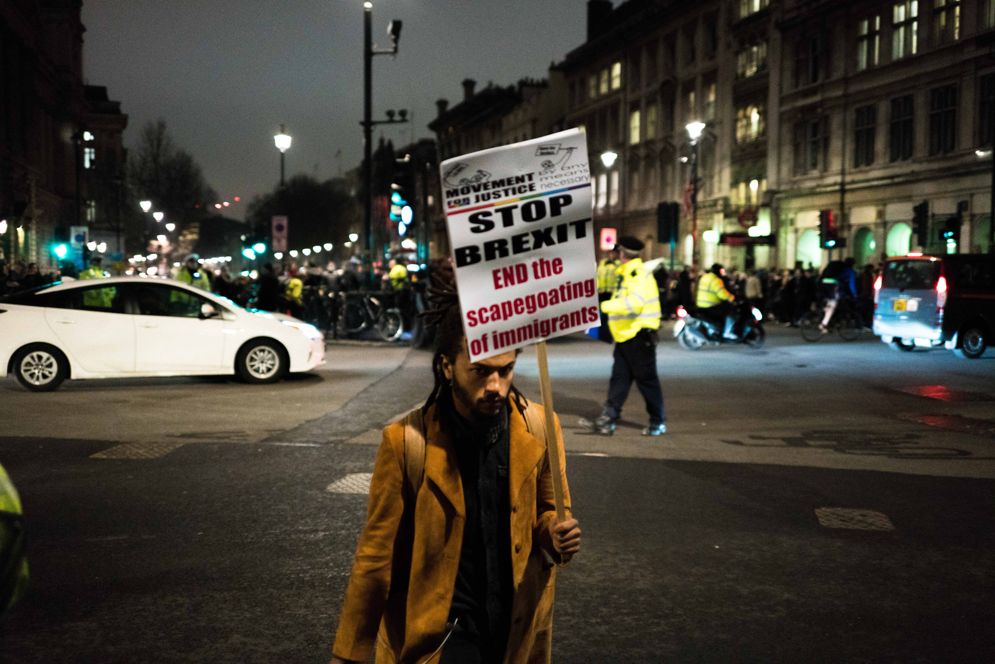 E 35mm F2 sample photo. Protester in the street photography