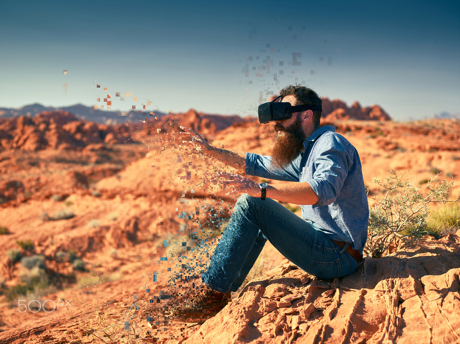 Phase One P65+ sample photo. Cool bearded guy wearing vr goggles in nevada desert with digita photography