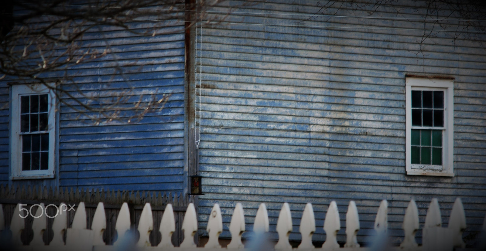 Manual Lens No CPU sample photo. Blue building and white fence photography