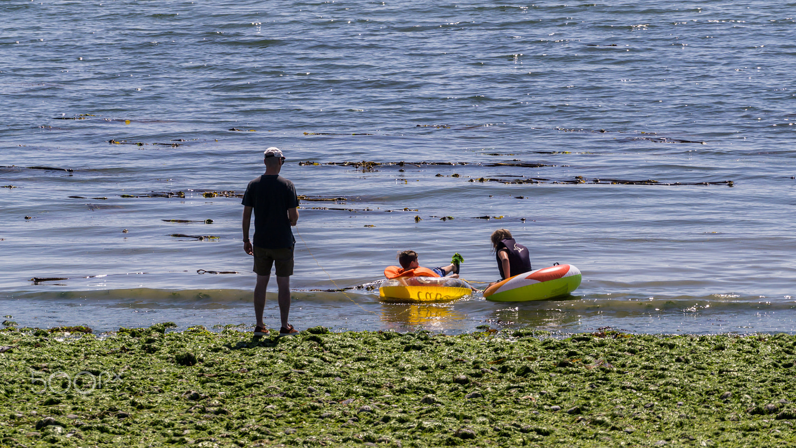 Sony a6000 + Sony FE 70-200mm F4 G OSS sample photo. Father looking after his kids with life buoy photography