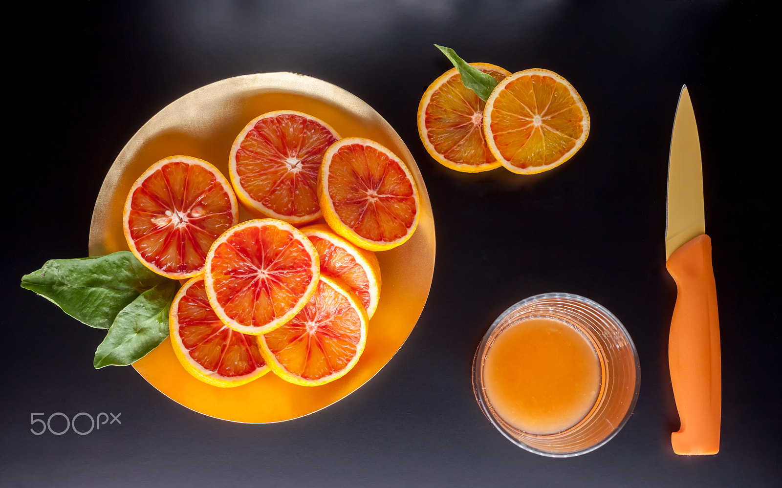 Canon EOS 500D (EOS Rebel T1i / EOS Kiss X3) sample photo. Red sicilian oranges glass and knife photography