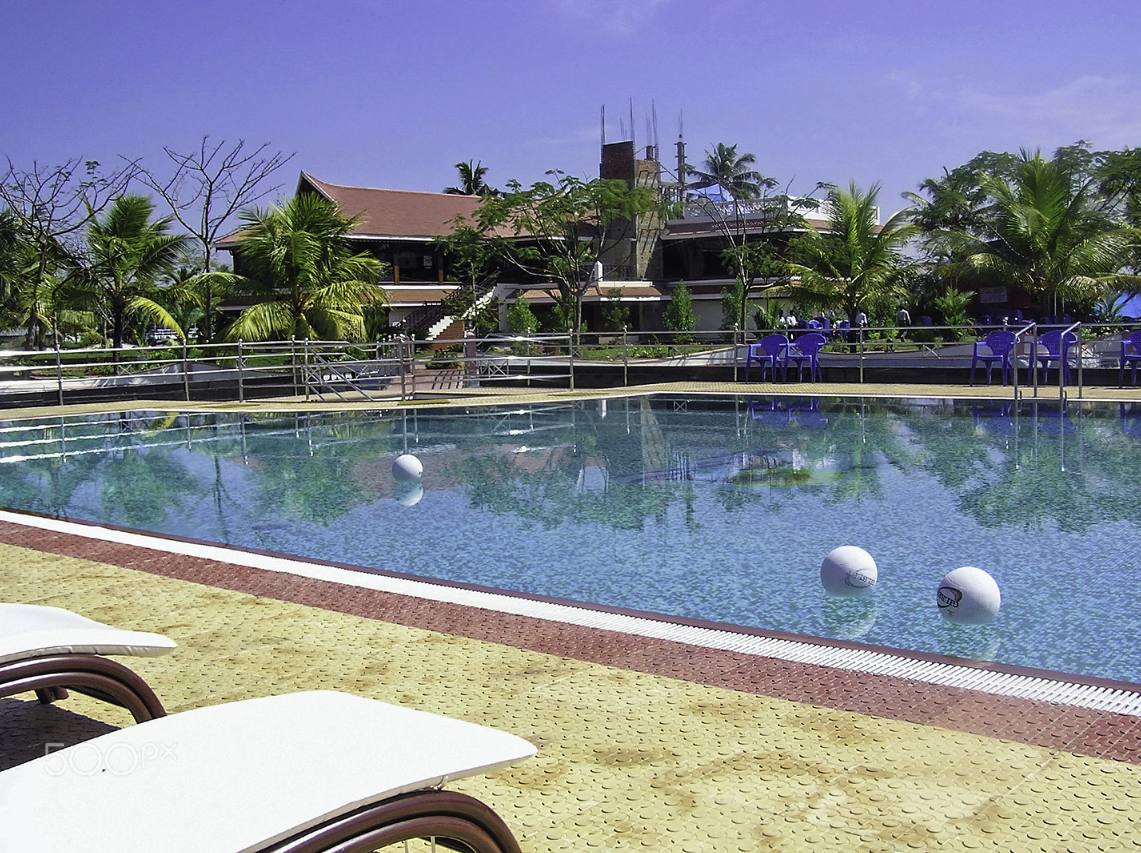 Olympus C750UZ sample photo. Pool with balls, and cottages in the resort in alleppey, kerala, photography