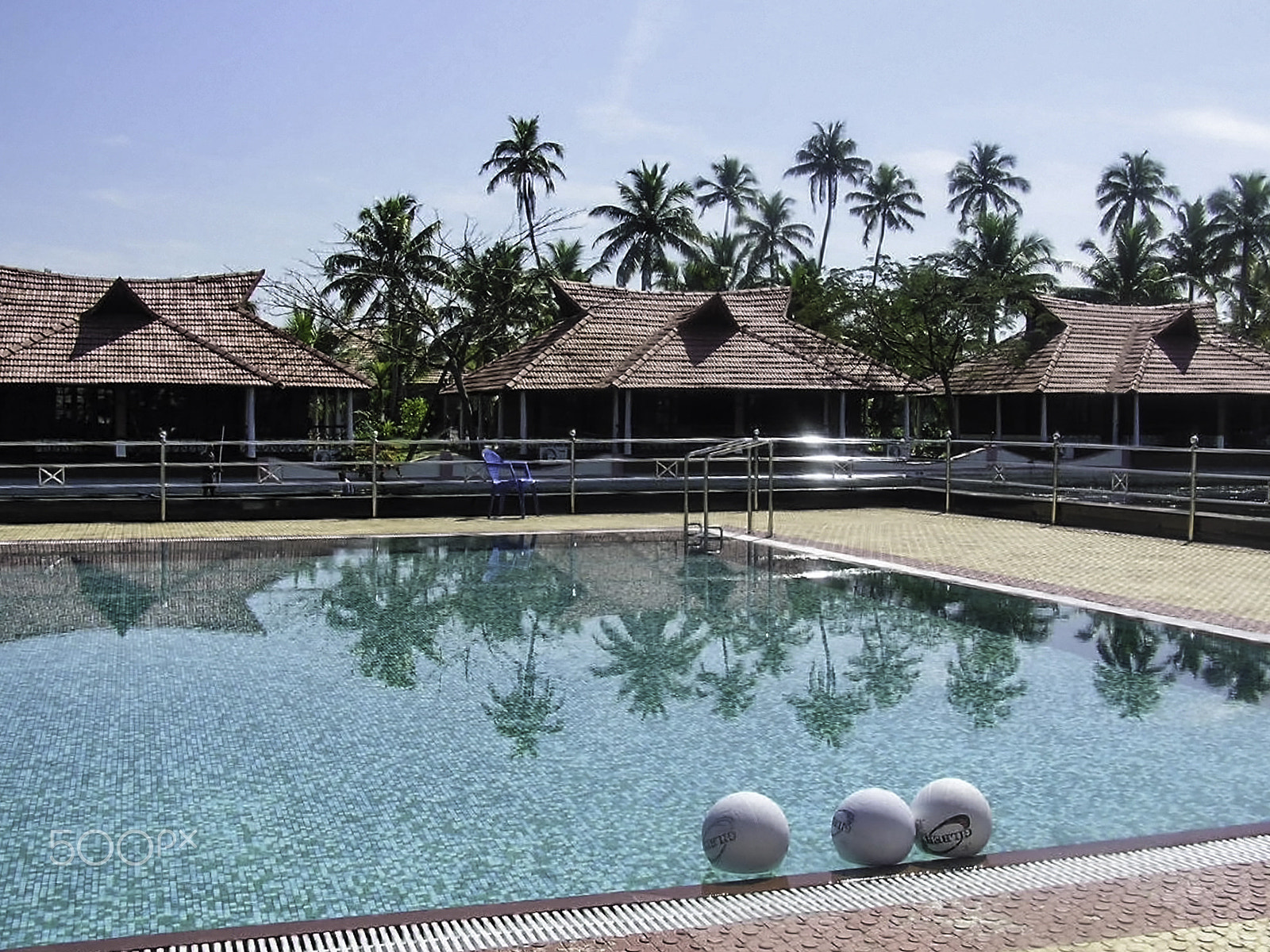 Olympus C750UZ sample photo. Balls lined up in the swimming pool in a resort in alleppey, ker photography