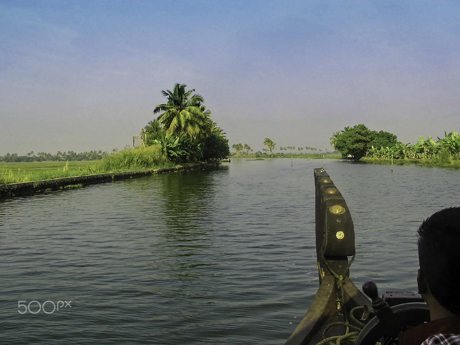 Olympus C750UZ sample photo. Captain of the houseboat surveying the saltwater canal in kerala photography