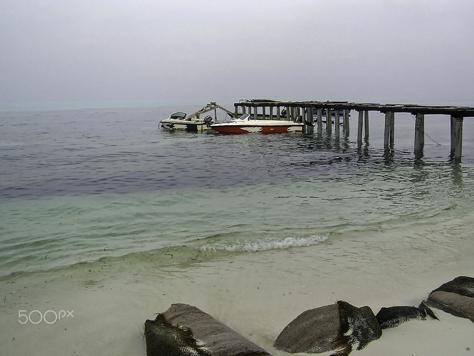 Olympus C750UZ sample photo. Speed boats tied to the pier in the kadamat islands of the laksh photography