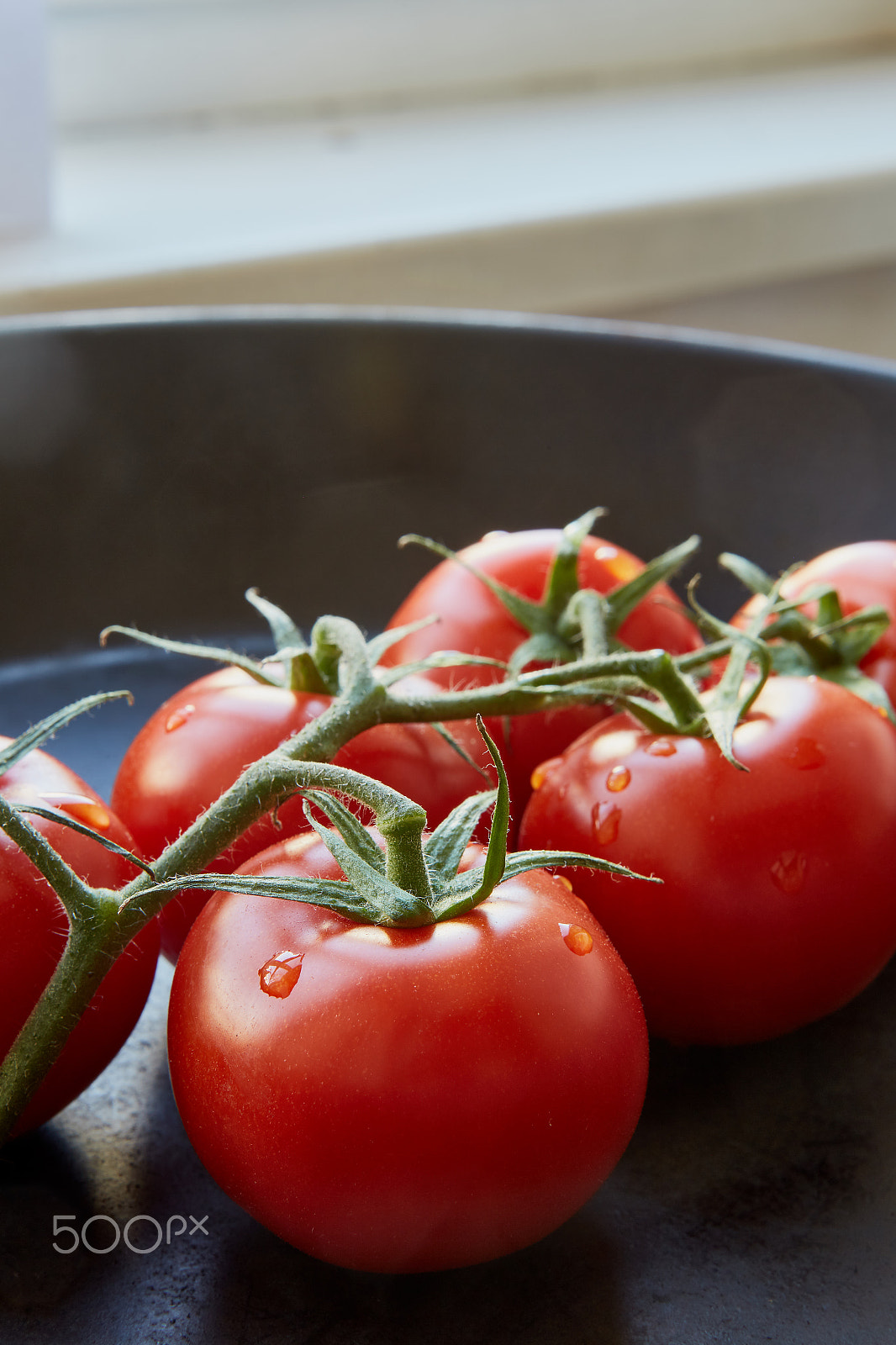 Canon EF 50mm F1.2L USM sample photo. Fresh cherry tomatoes on dark background photography