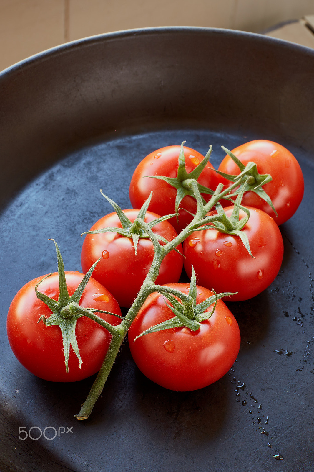 Canon EF 50mm F1.2L USM sample photo. Fresh cherry tomatoes on dark background photography