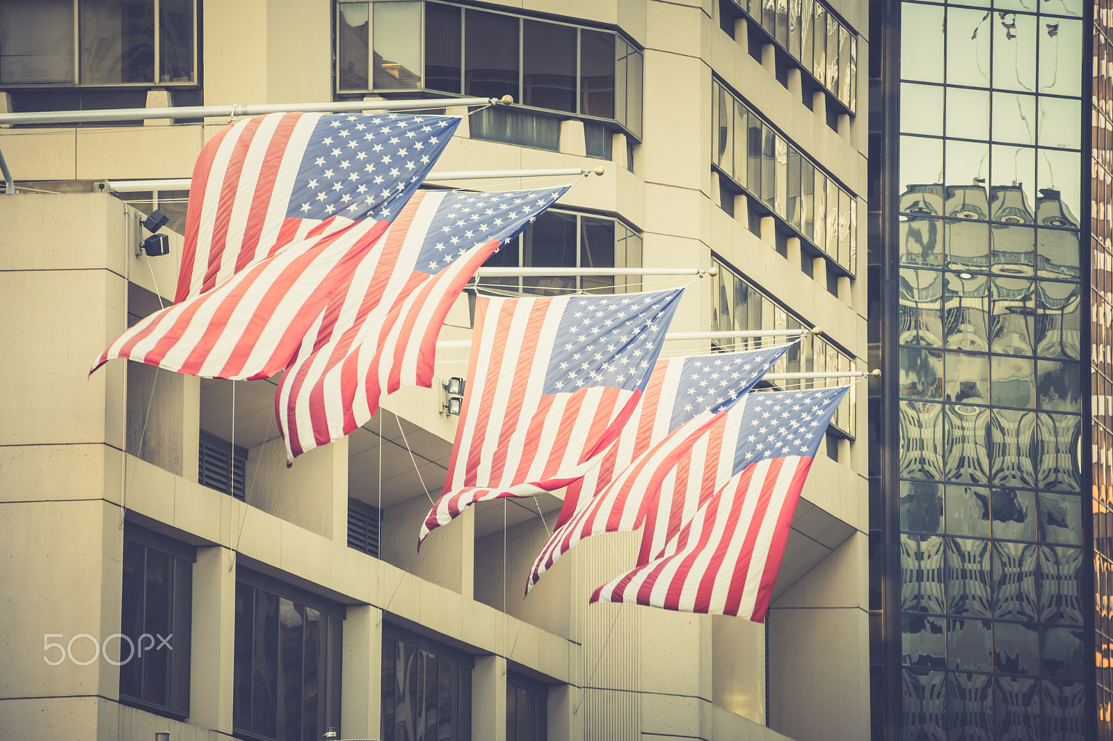 Tamron SP 70-300mm F4-5.6 Di USD sample photo. American flags on flagpoles on building photography