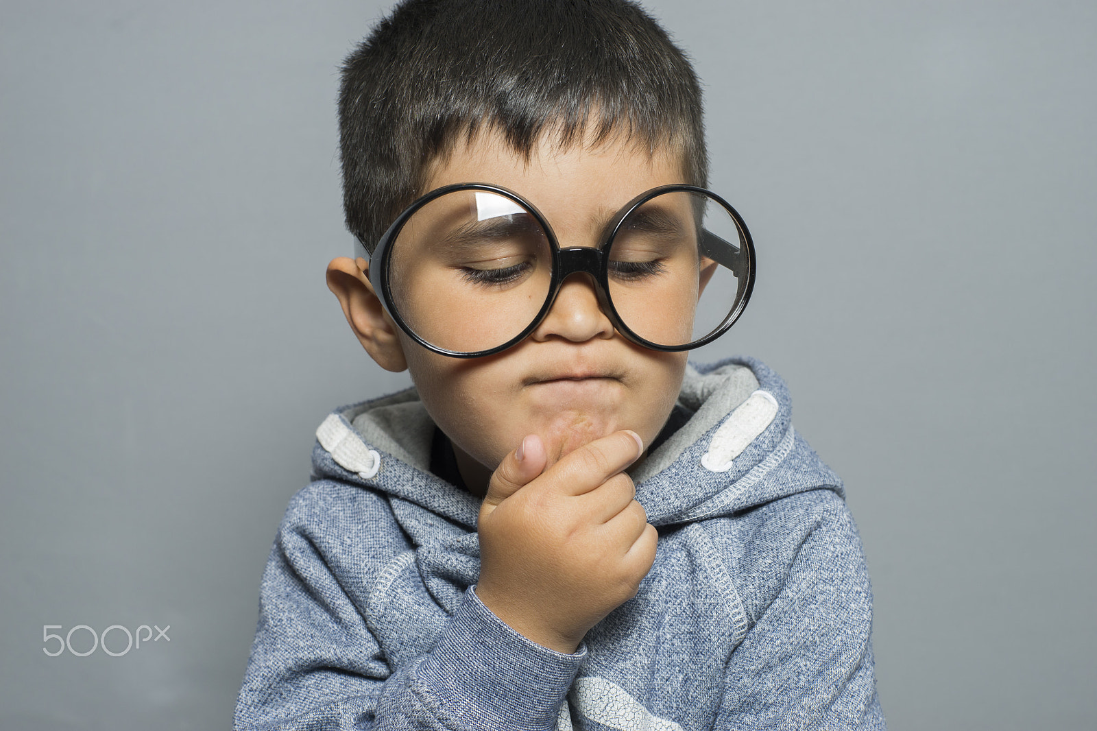 Sony a7 + Sony DT 50mm F1.8 SAM sample photo. Thinking, boy with big glasses very serious and thinking photography