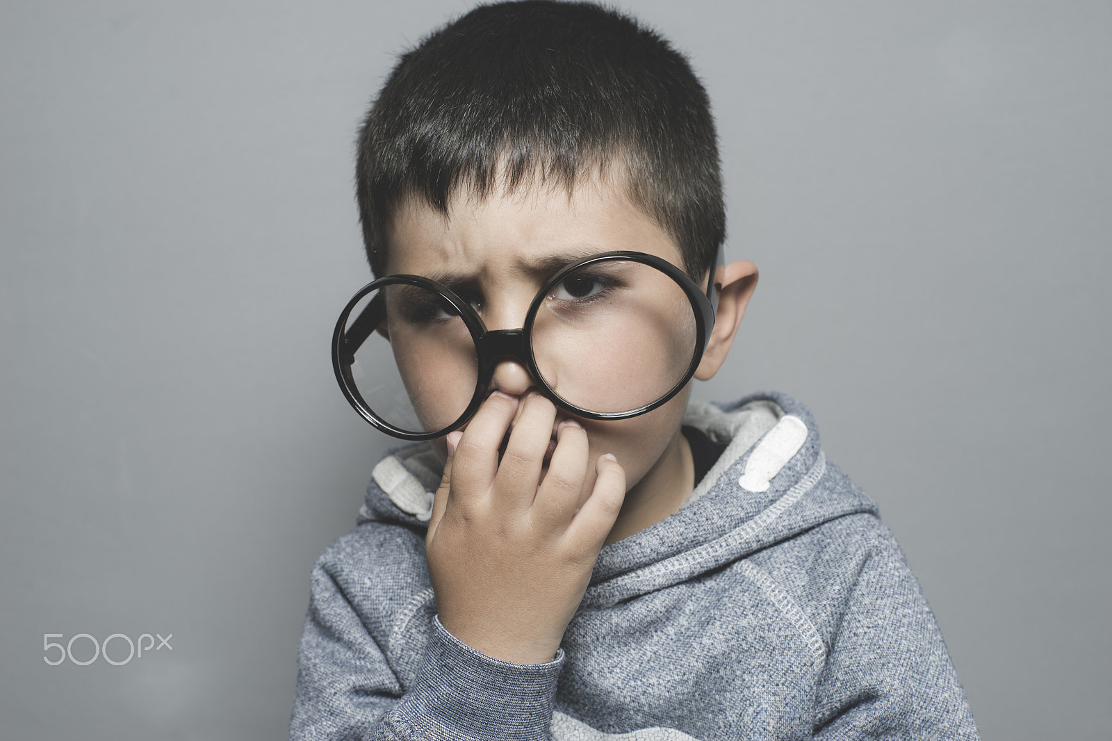 Sony a7 + Sony DT 50mm F1.8 SAM sample photo. Thinking, boy with big glasses very serious and thinking photography