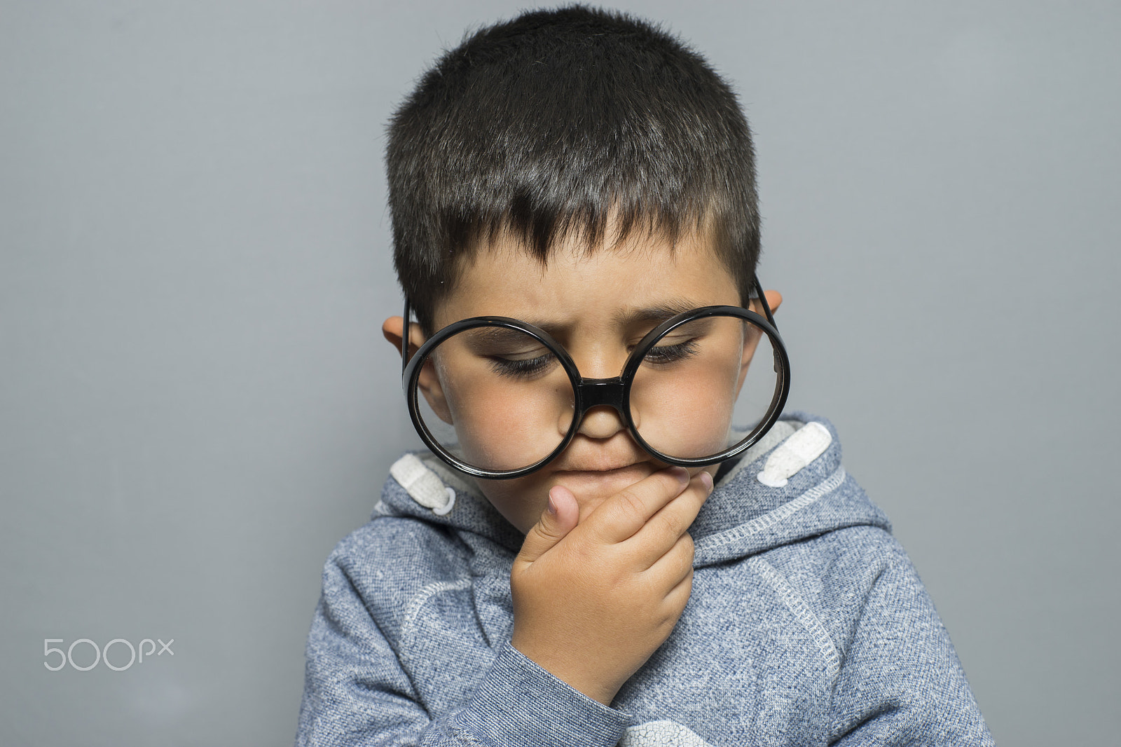 Sony a7 + Sony DT 50mm F1.8 SAM sample photo. Dark-haired young student with big glasses thinking gesture photography