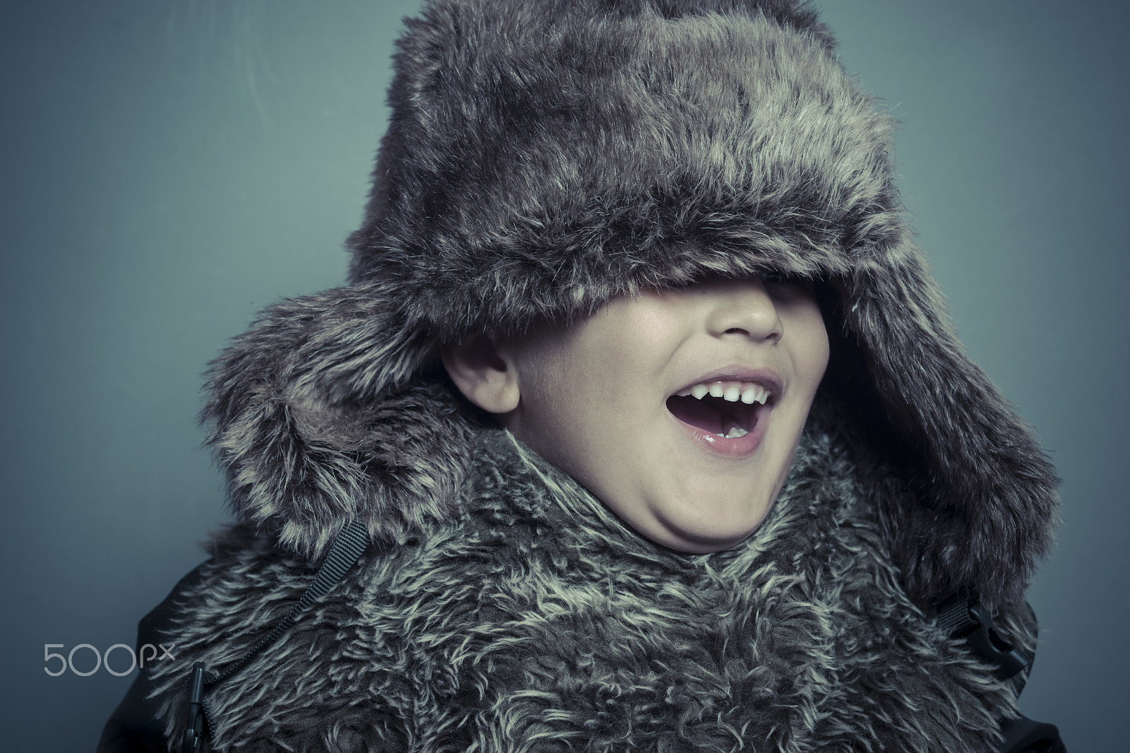 Sony a7 + Sony DT 50mm F1.8 SAM sample photo. Funny child with fur hat and winter coat, cold concept and storm photography