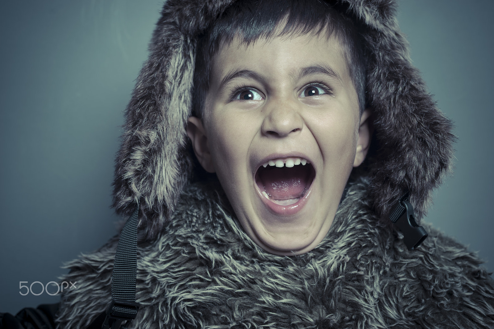 Sony a7 + Sony DT 50mm F1.8 SAM sample photo. Funny child with fur hat and winter coat, cold concept and storm photography