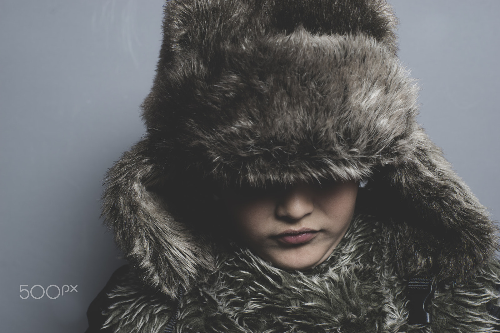 Sony a7 + Sony DT 50mm F1.8 SAM sample photo. Sad child with fur hat and winter coat, cold concept and storm photography