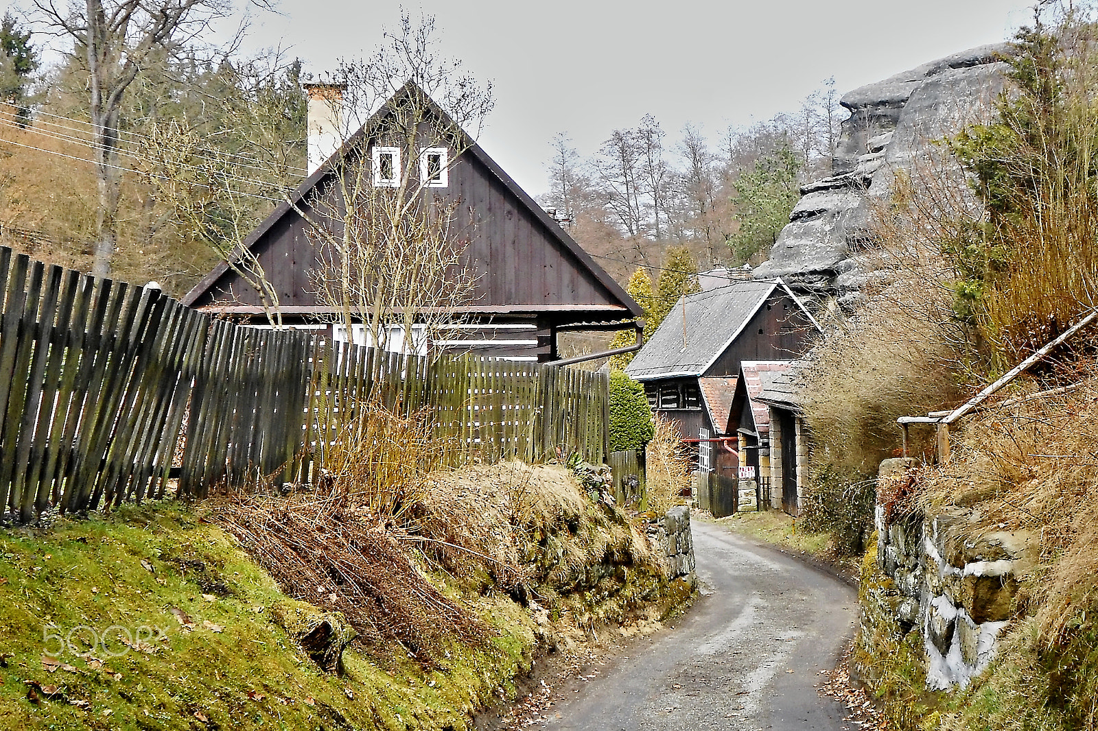 Nikon Coolpix S3300 sample photo. Karba, machuv kraj, czech republic - april 14, 2013: wooden cottages and rock on background in... photography