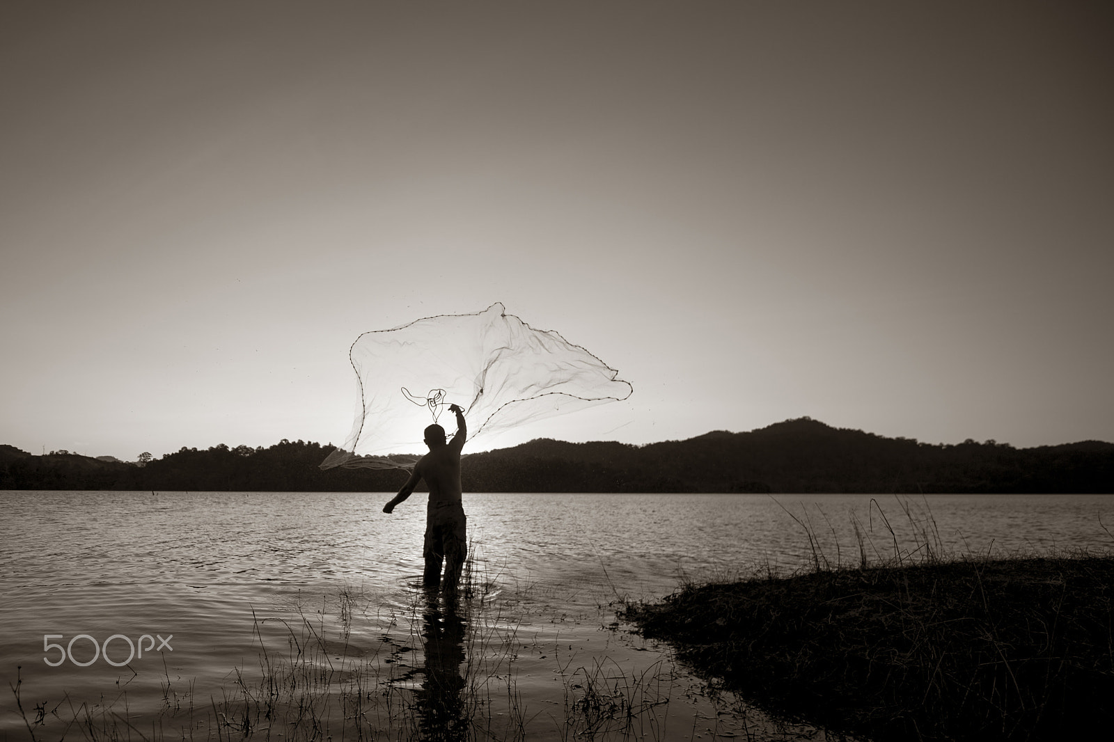 Nikon Df sample photo. Fisherman throw a cast net photography