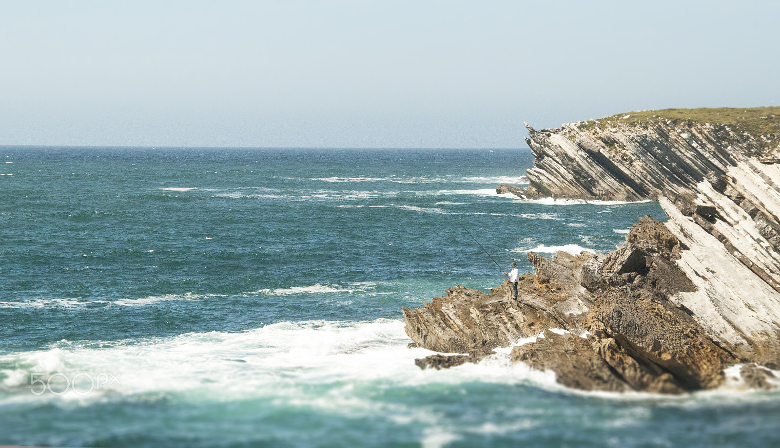 Nikon D5000 + Sigma 18-200mm F3.5-6.3 DC OS HSM sample photo. A tiny fisherman photography