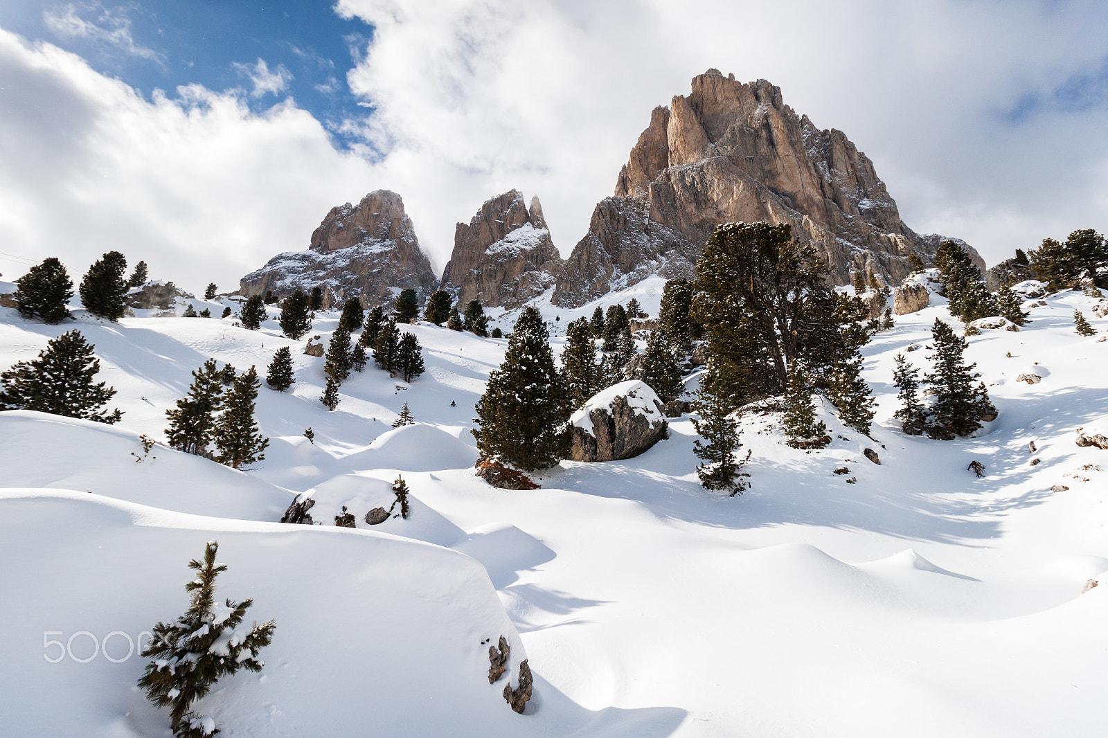Canon EOS 500D (EOS Rebel T1i / EOS Kiss X3) + Canon EF-S 10-18mm F4.5–5.6 IS STM sample photo. The sassolungo (langkofel) group of the italian dolomites in winter photography