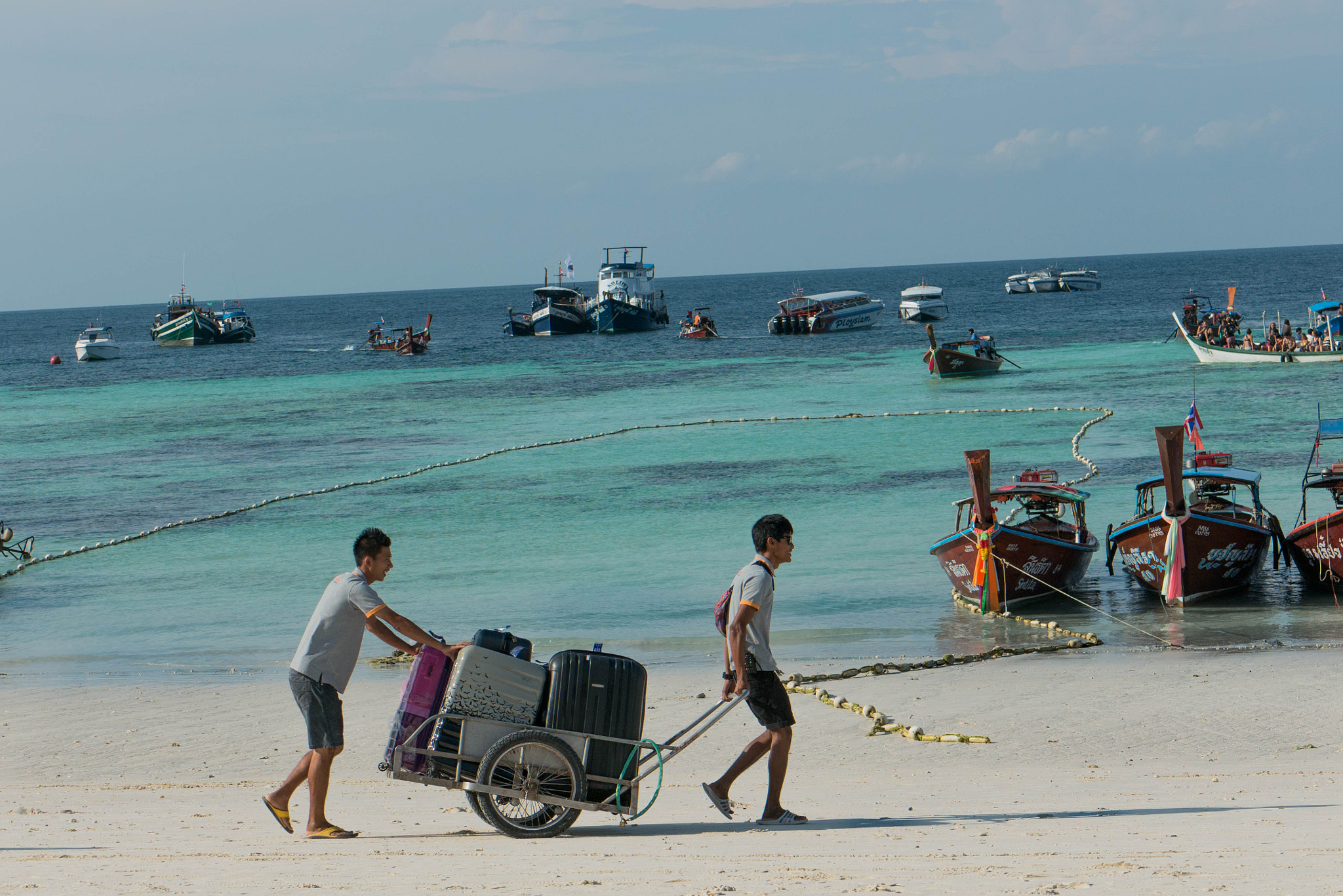 Panasonic Lumix G 42.5mm F1.7 ASPH Power OIS sample photo. Koh lipe beach - bell boy service photography