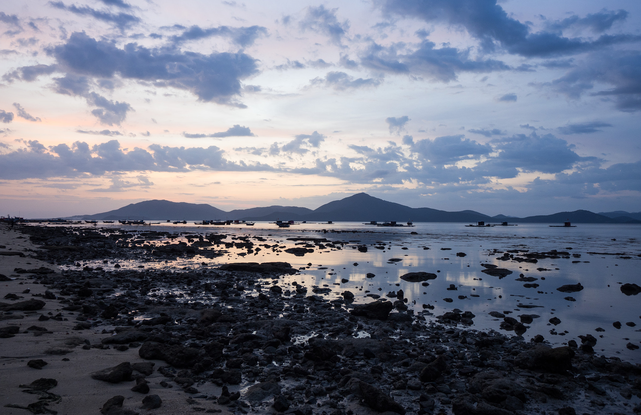 Panasonic Lumix G Vario 7-14mm F4 ASPH sample photo. Clouds and pebbles photography
