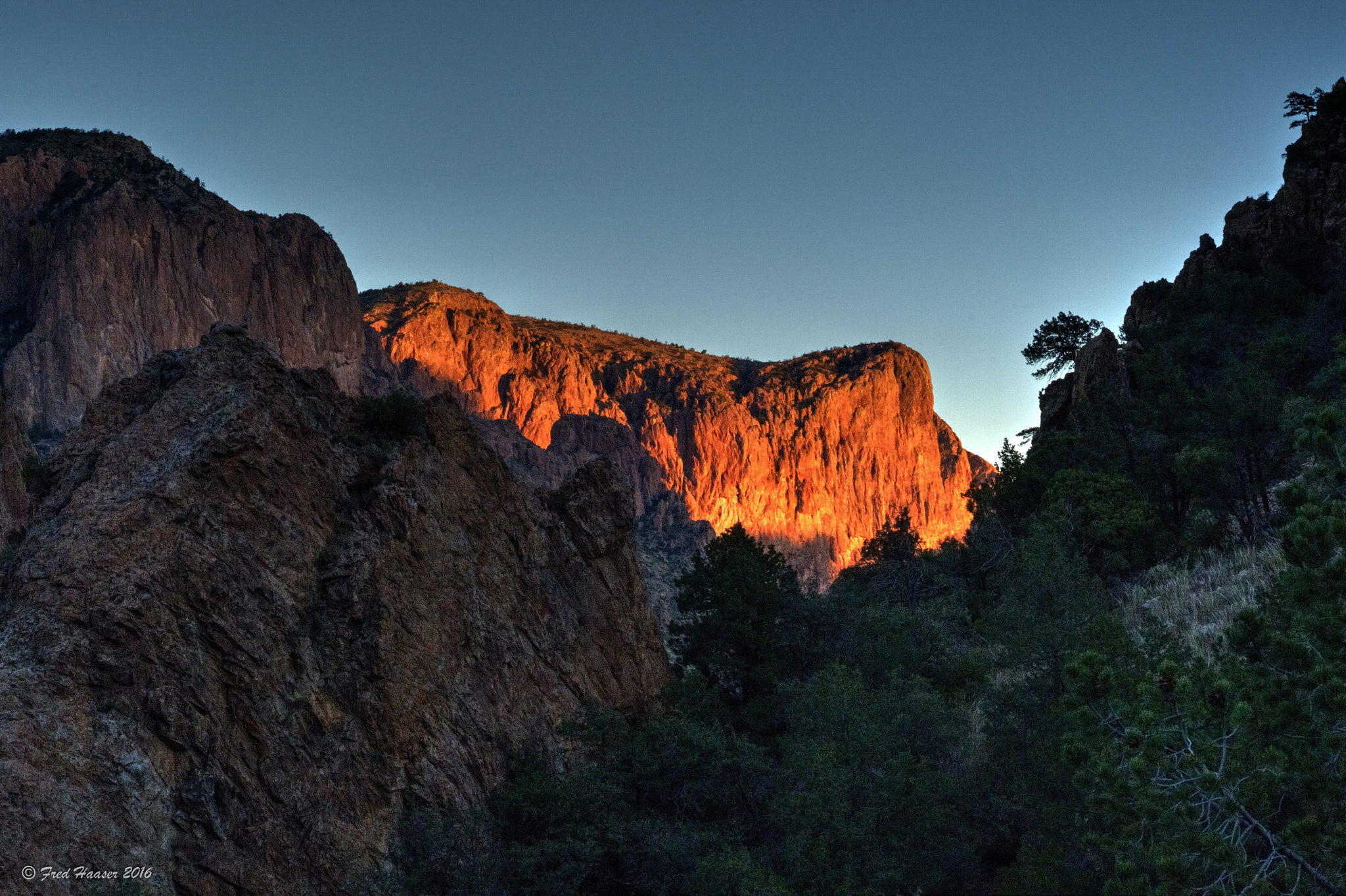 Nikon AF-S Nikkor 24-70mm F2.8E ED VR sample photo. Sunrise lights up distant peak in big bend park photography