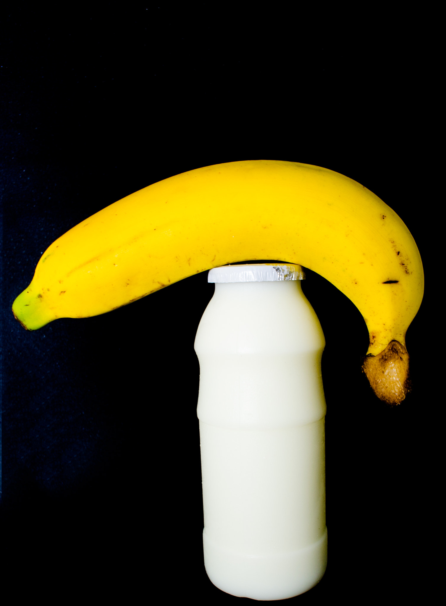 Nikon 1 Nikkor 10mm F2.8 sample photo. Banana and milk photography