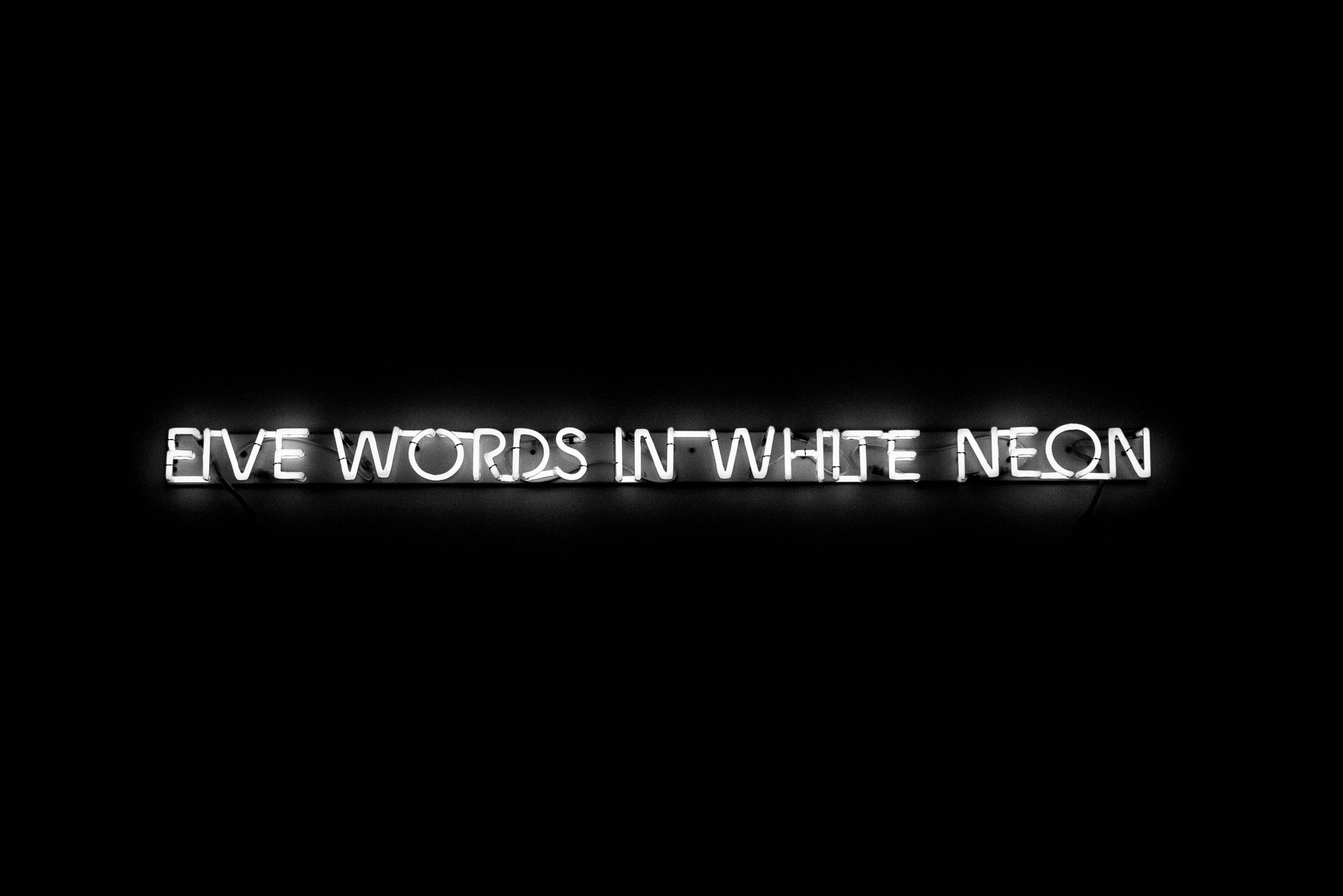 Canon EF-S 18-55mm F3.5-5.6 IS sample photo. Five words in white neon photography