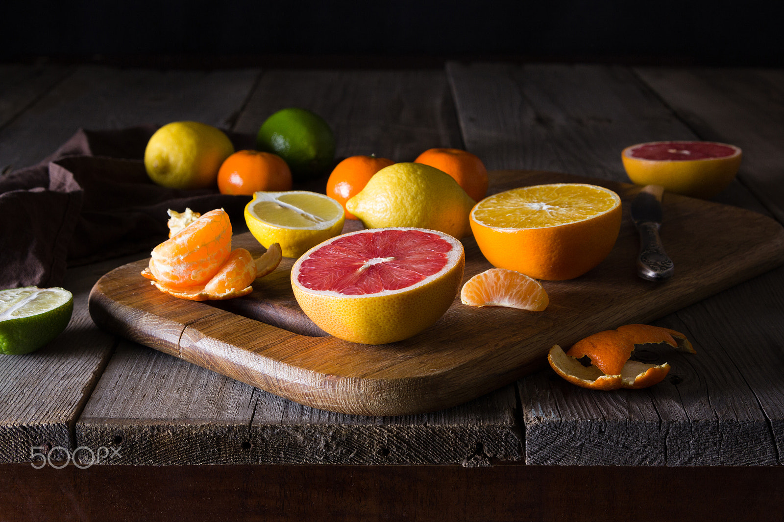 Canon EOS 60D + Tamron AF 28-75mm F2.8 XR Di LD Aspherical (IF) sample photo. Various types of citrus fruit on a dark wooden background photography