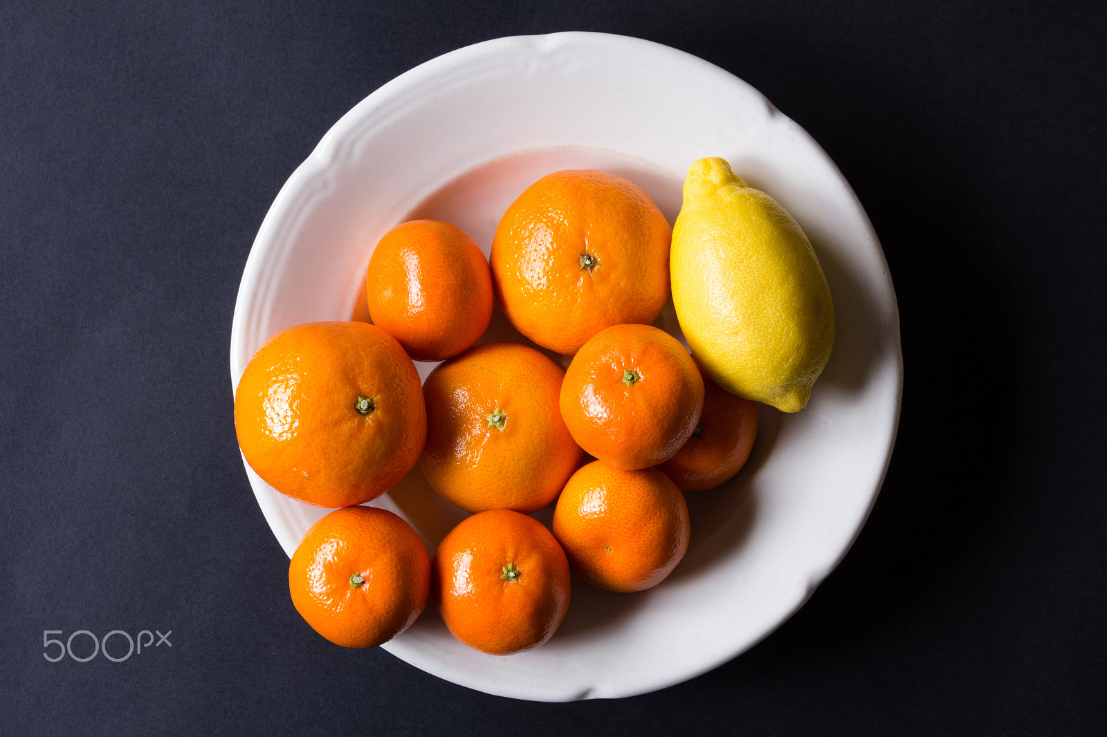 Canon EOS 60D sample photo. Various types of citrus fruit on a dark background photography