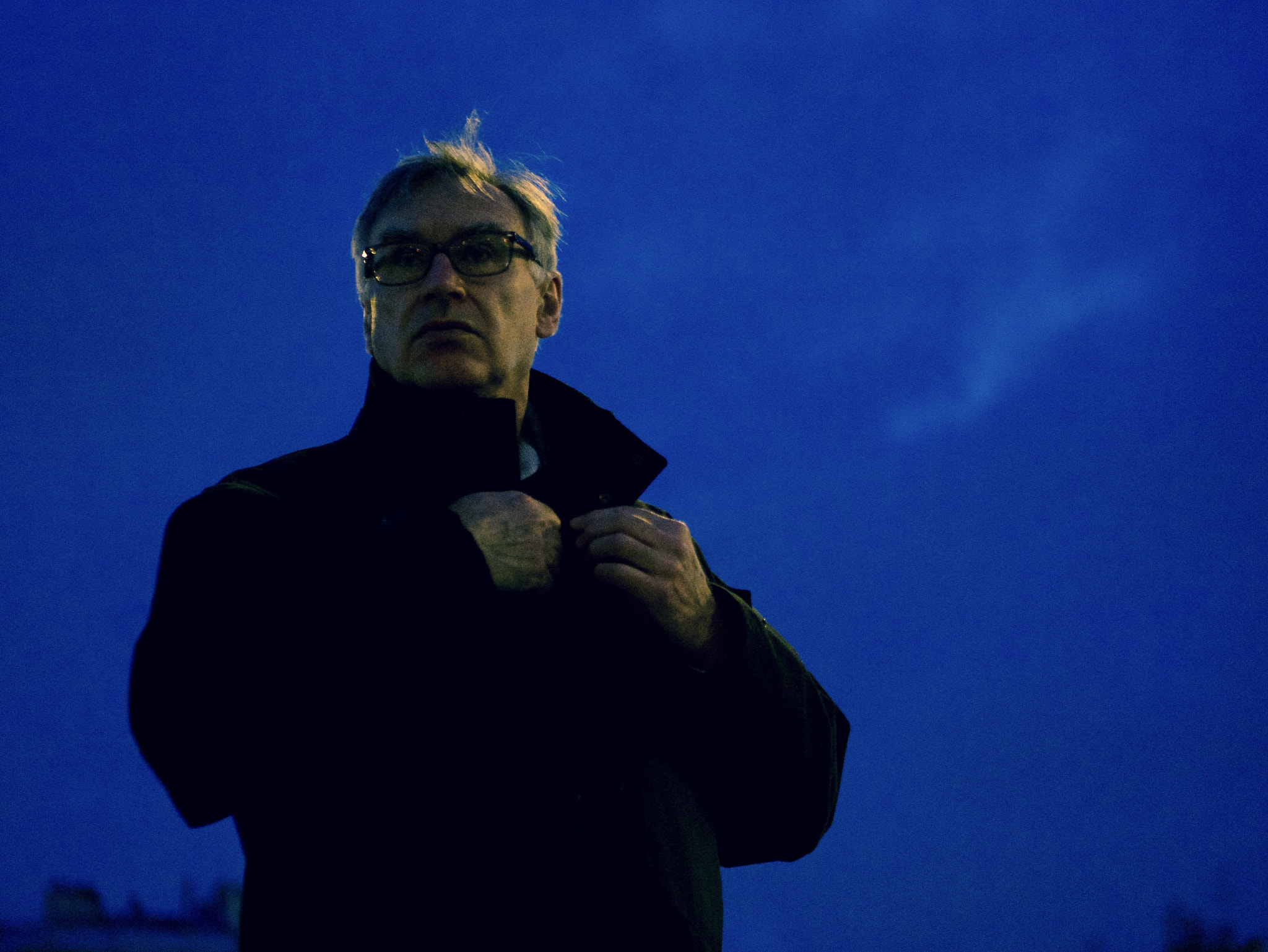 Panasonic Lumix G 42.5mm F1.7 ASPH Power OIS sample photo. Man in a coat - stolen portrait in paris photography