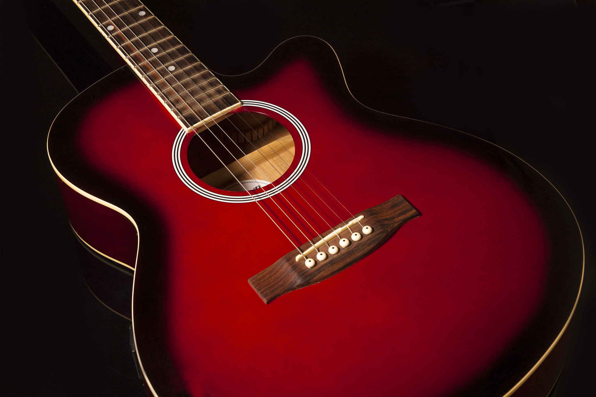Canon EOS 500D (EOS Rebel T1i / EOS Kiss X3) sample photo. Acoustic guitar on black background photography