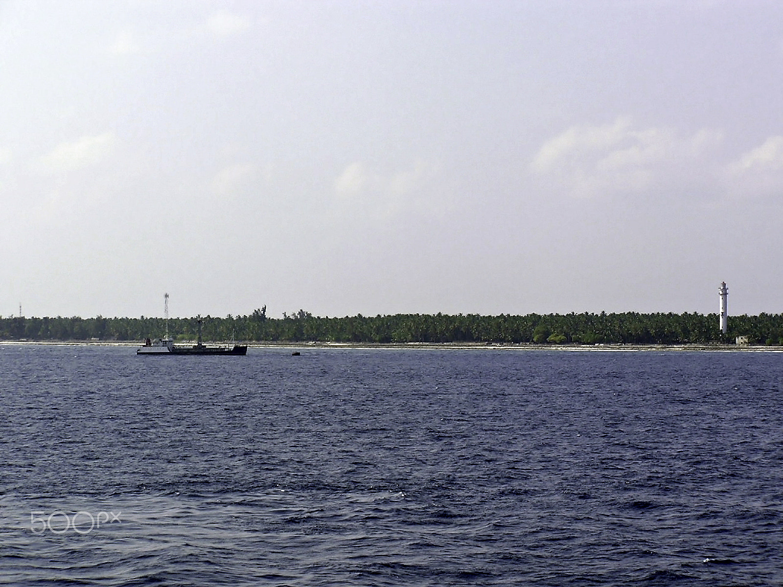 Olympus C750UZ sample photo. Lighthouse and ship on one of the islands of the lakshadweep photography
