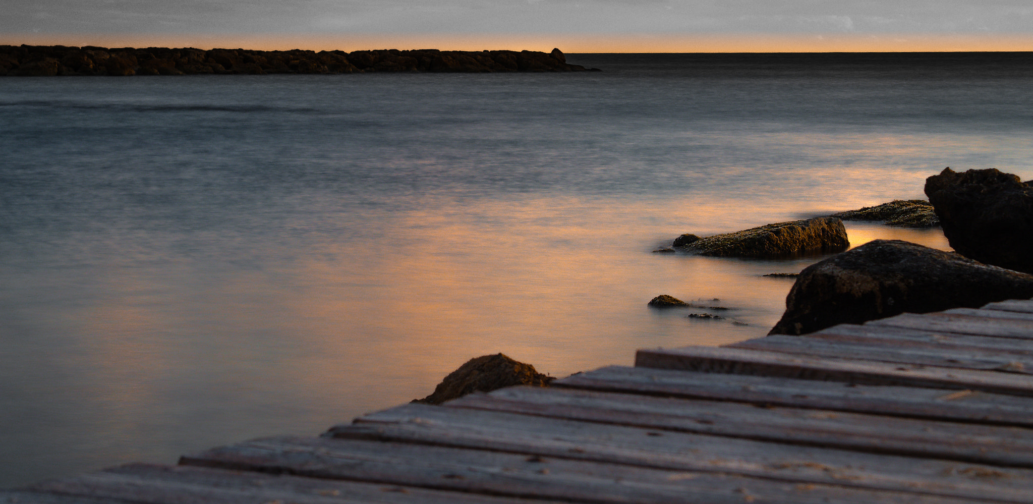 Olympus OM-D E-M10 sample photo. Sitting in a wooden pier photography