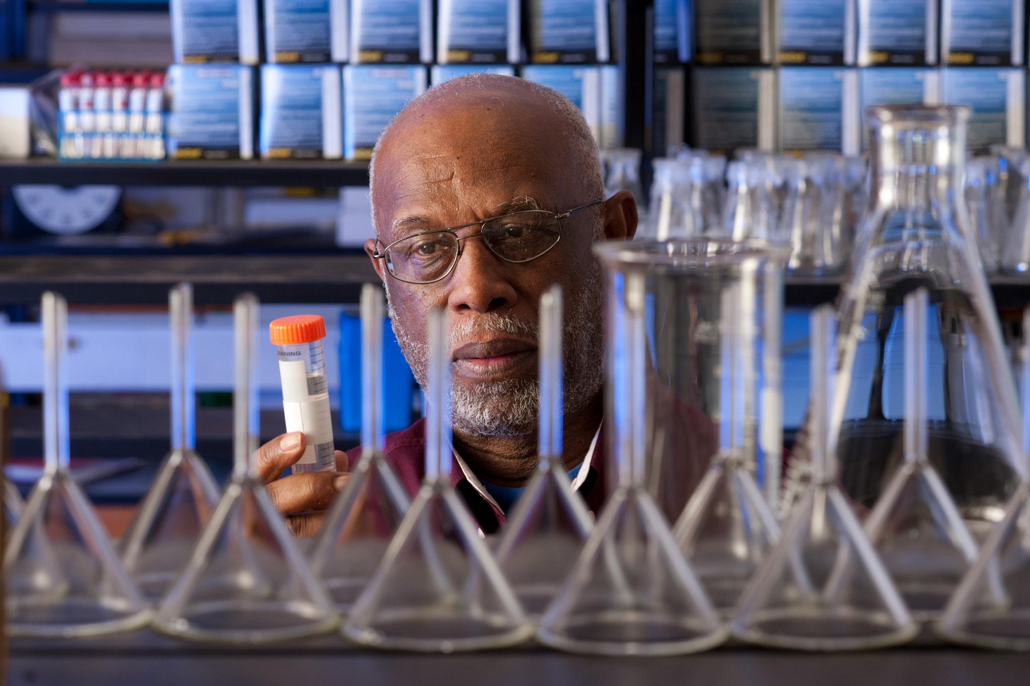 AF DC-Nikkor 135mm f/2 sample photo. Researcher in a lab studying a sample photography